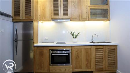 The kitchen has a built-in oven, dishwasher